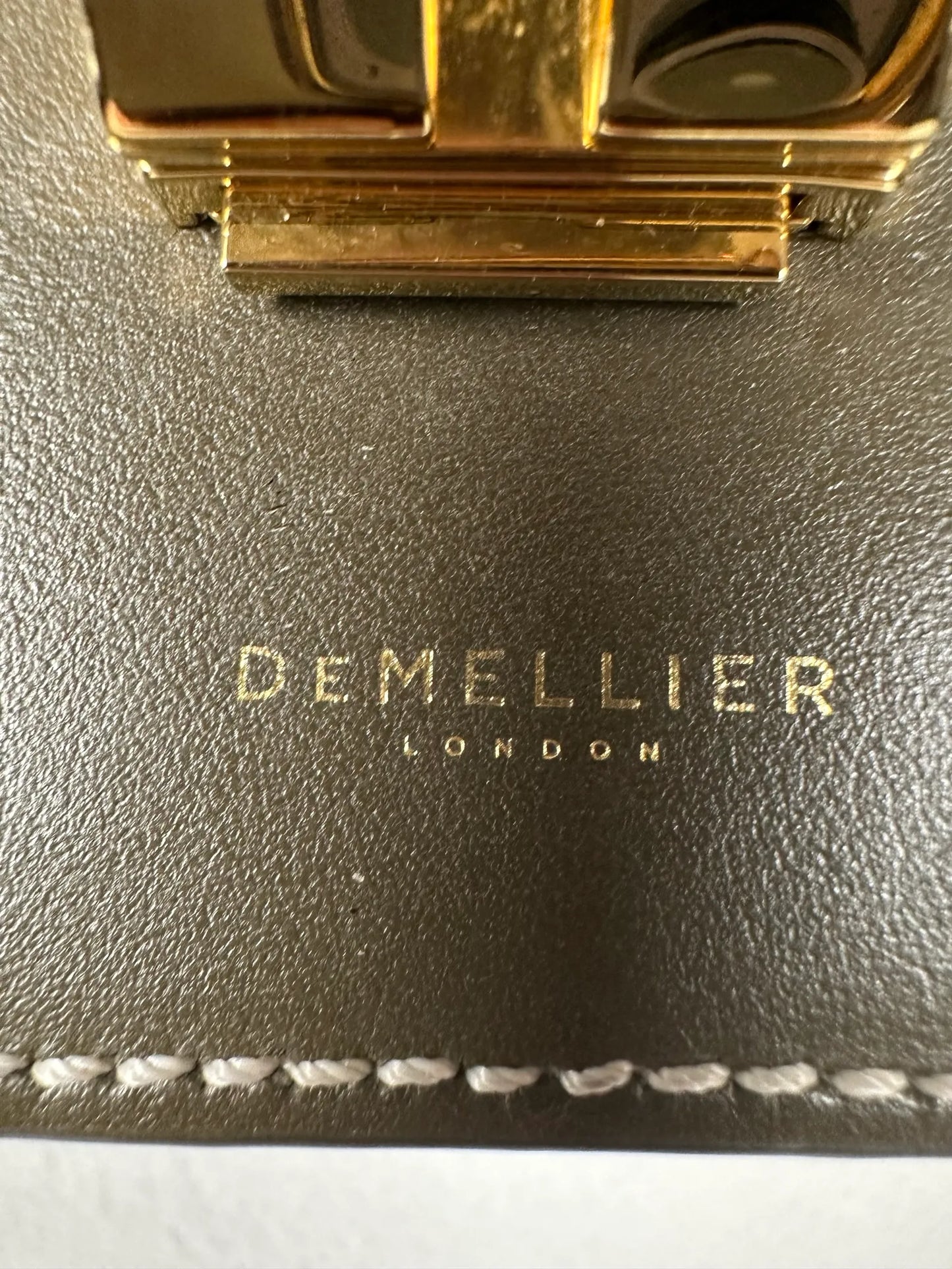 Demellier Vancouver-skinnaxelremsväska