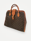 Louis Vuitton Rivoli-skinndatorväska