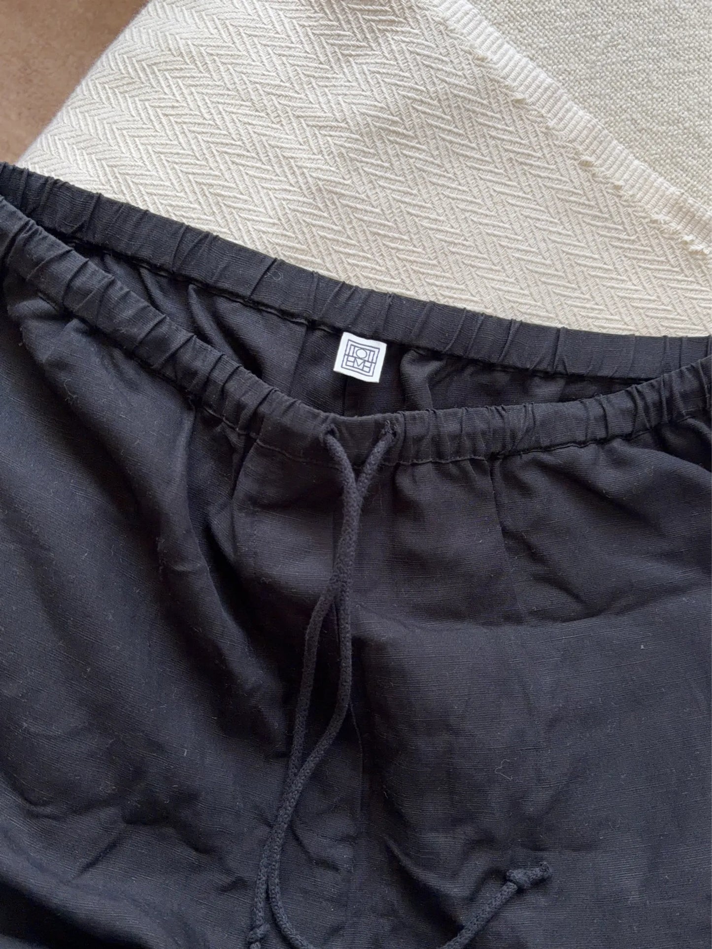 Toteme Press-creased Drawstring Trousers