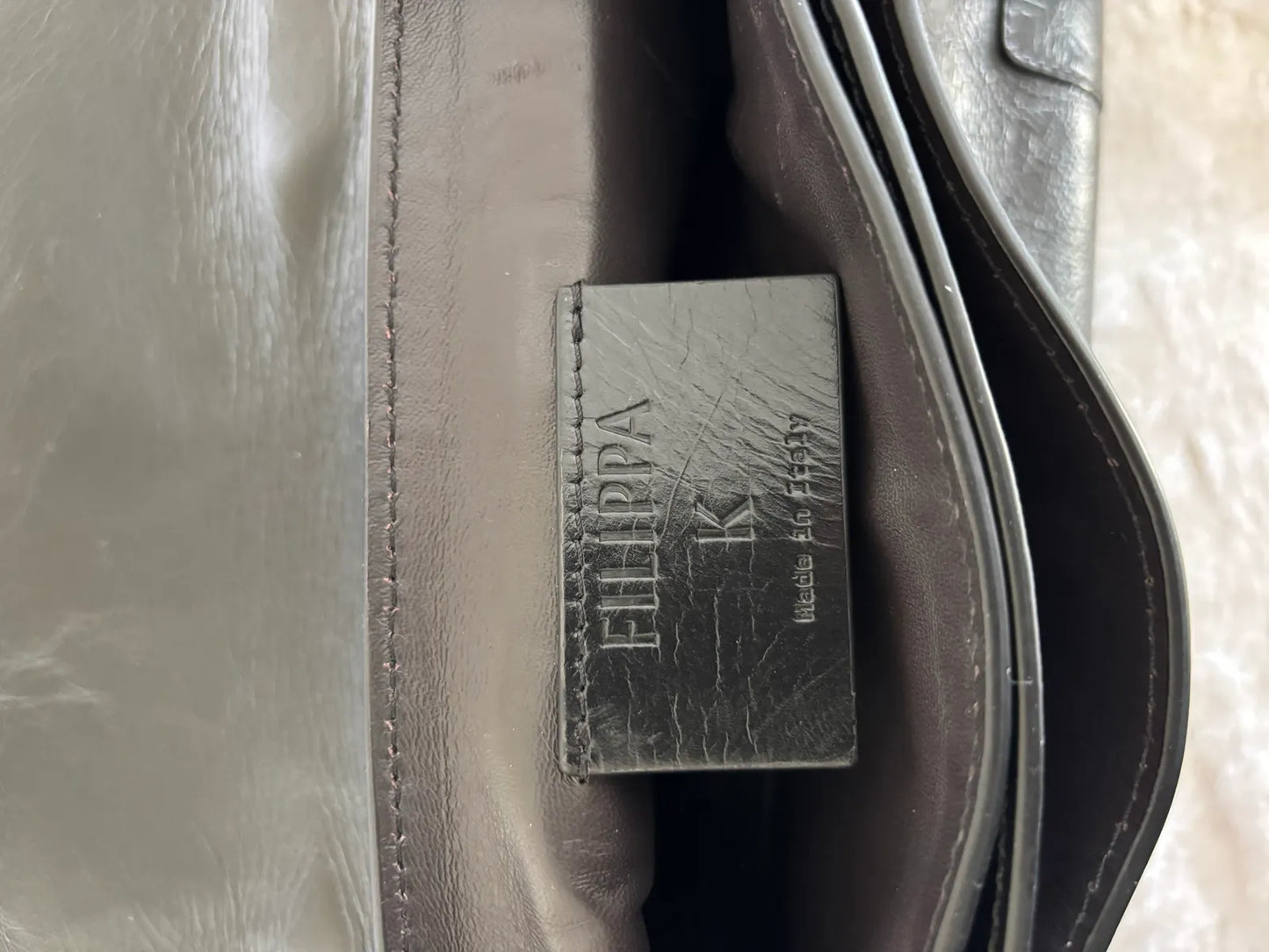 Filippa K 93 Monogram-skinnaxelremsväska