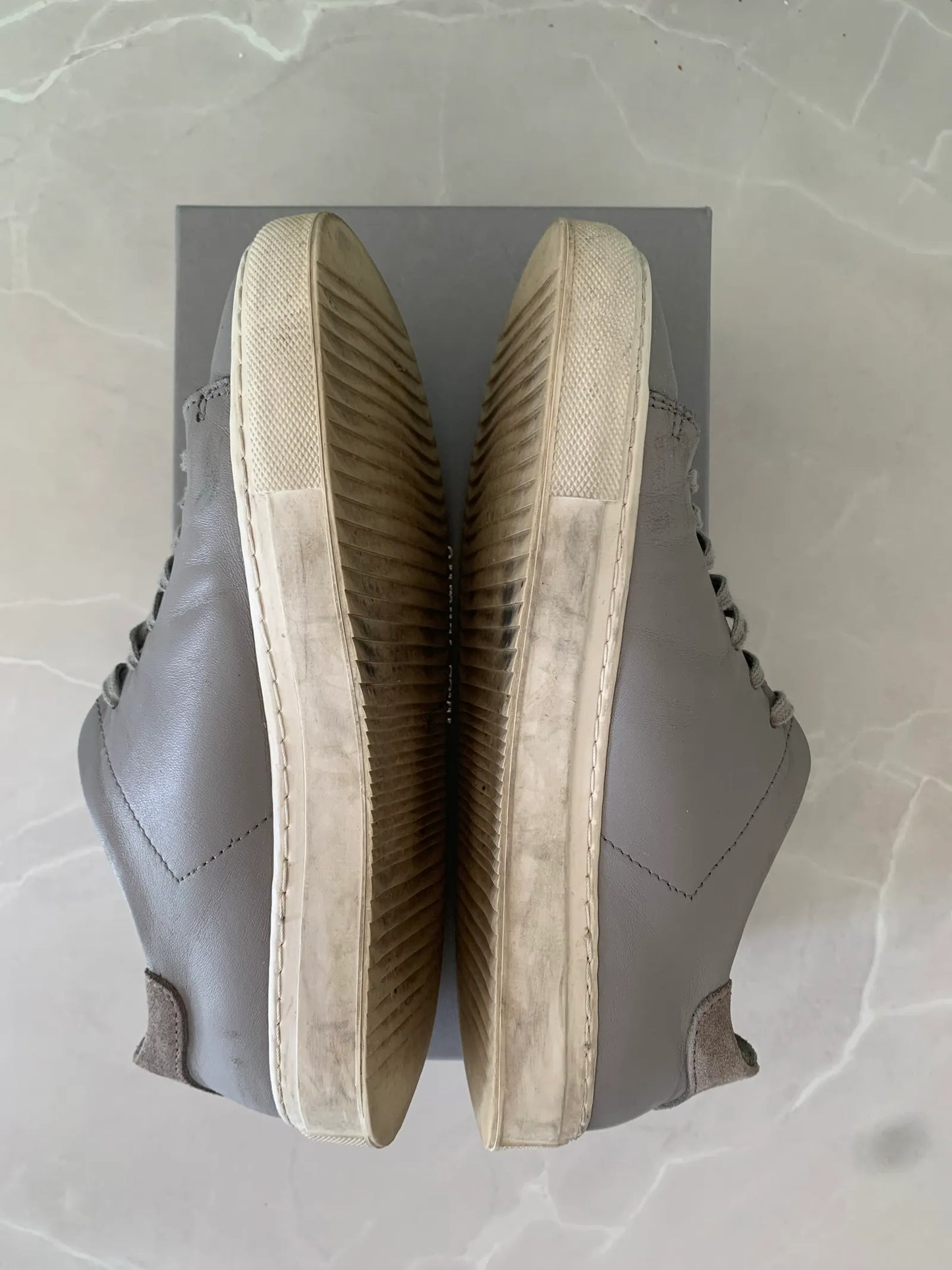 Axel Arigato-skinnsneakers