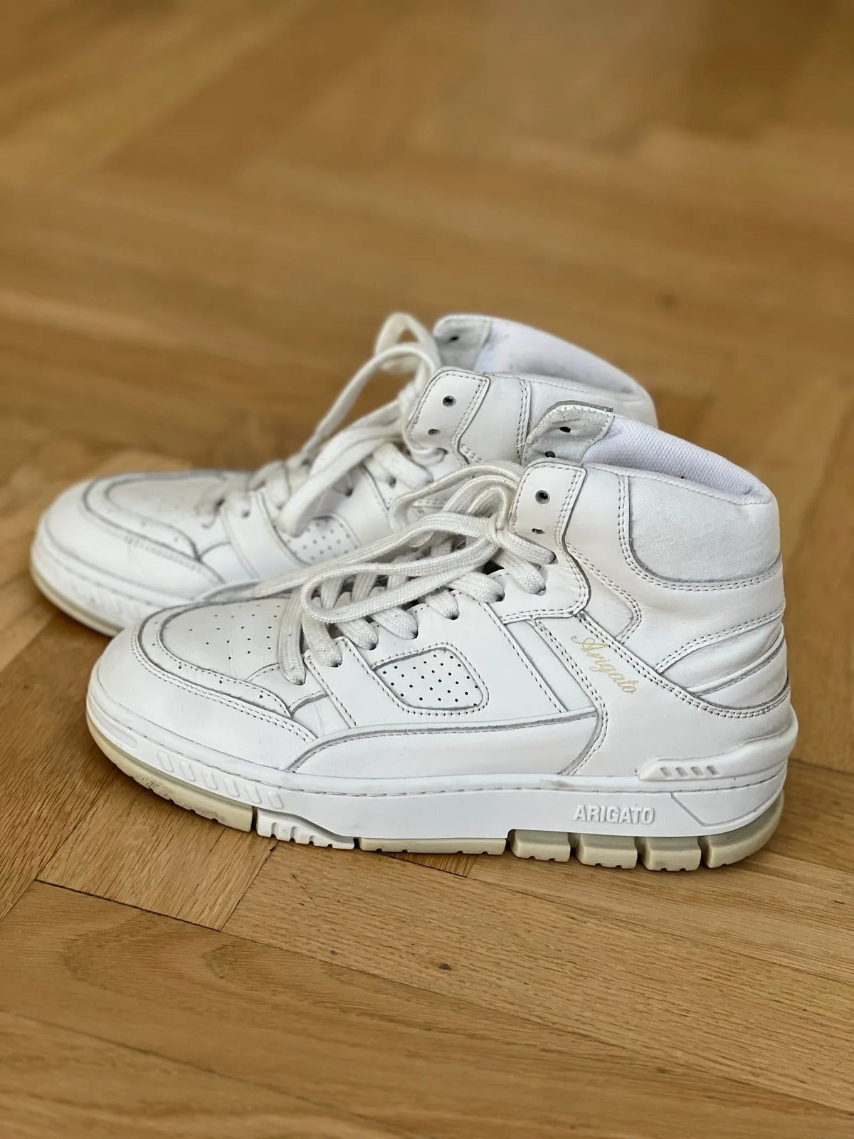 Axel Arigato-skinnsneakers